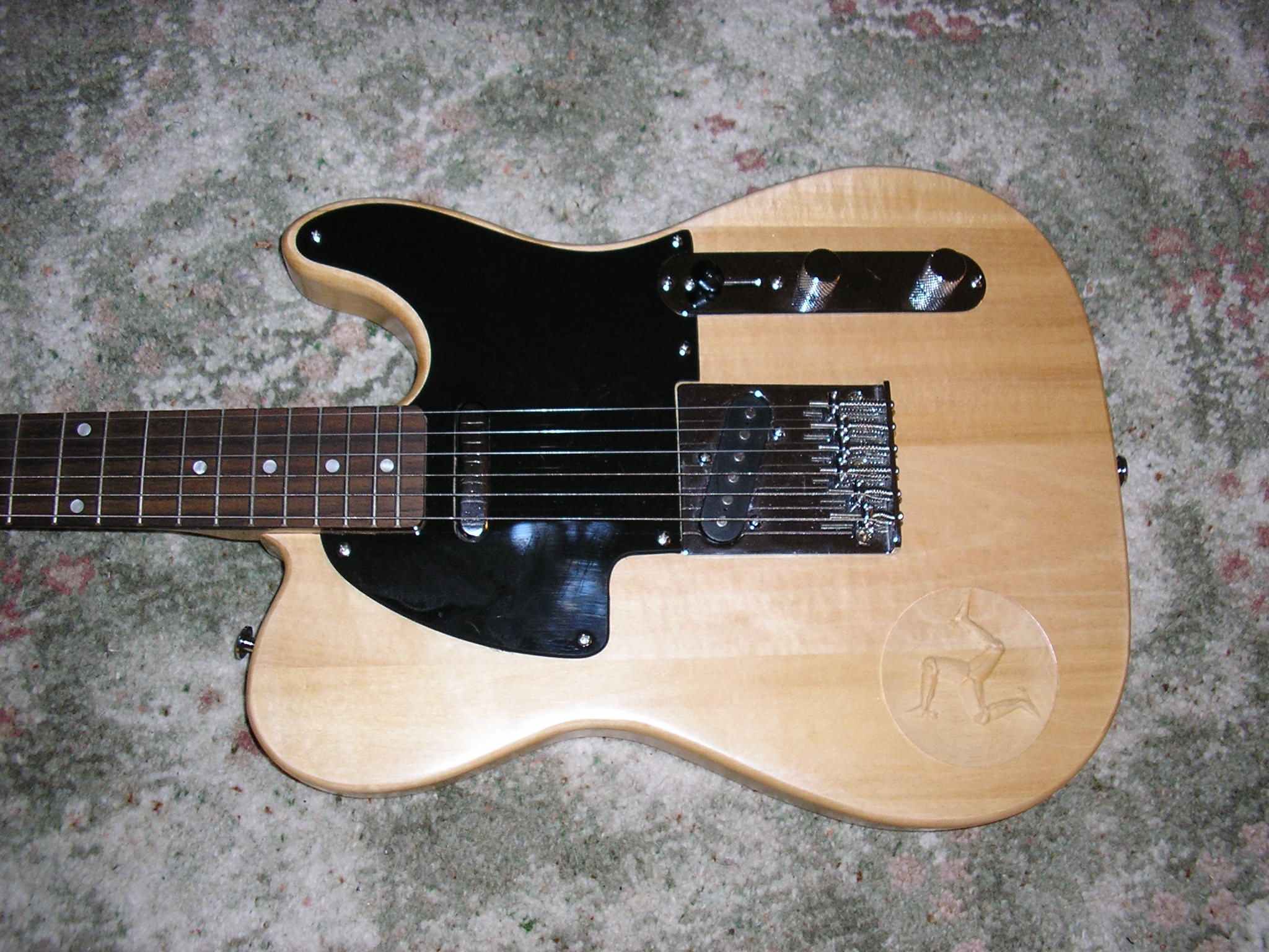 Telecaster style with clear nitrocelluloseand 3legs CNC carving